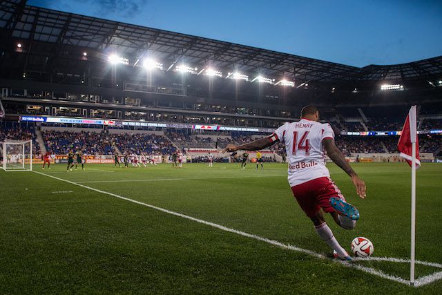 Thierry Henry takes a corner kick during the match.